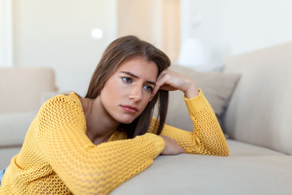 woman on the couch looking problematic