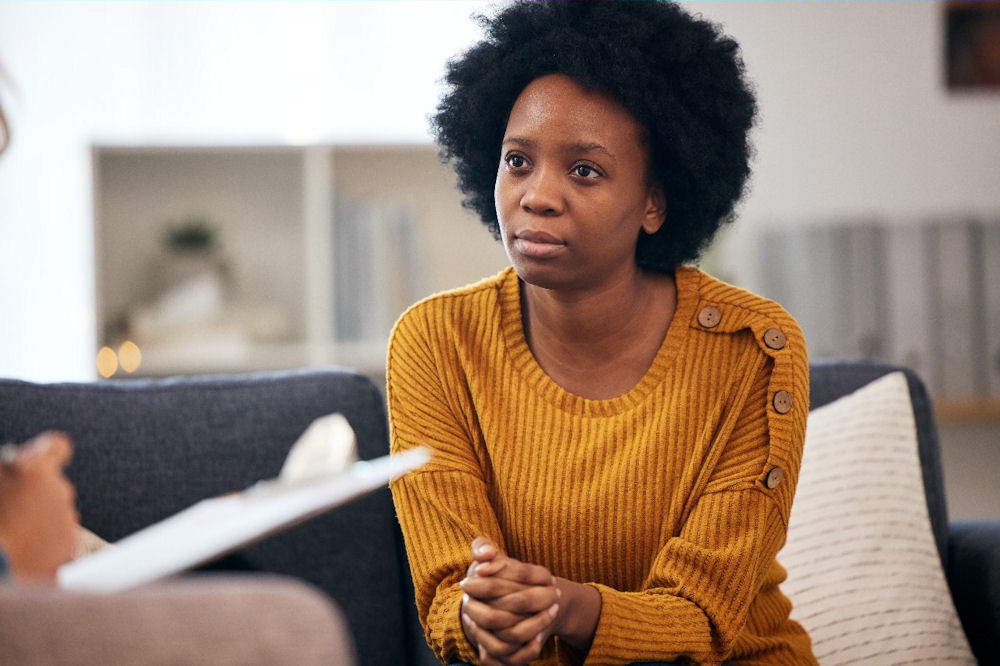 Woman in therapy session discussing ketamine use and addiction risk
